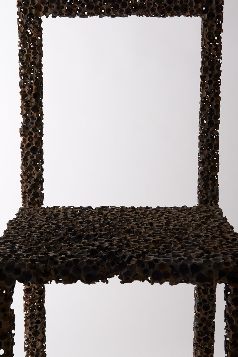 pockmarked drought chair by we takes shape as it dries