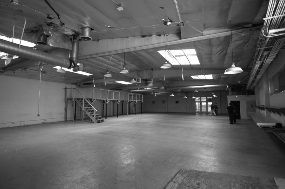 1296381494-existing-warehouse-interior-before-lehrer-architects-bw.jpg