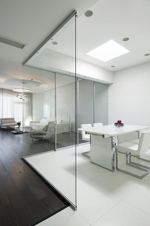 kitchen-semi-open-plan-with-retractable-glass-walls-and-large-white-floor-tiles.jpg