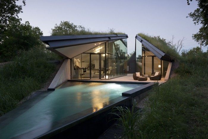 house-built-into-hill-moonlit-pool-front-700x467.jpeg