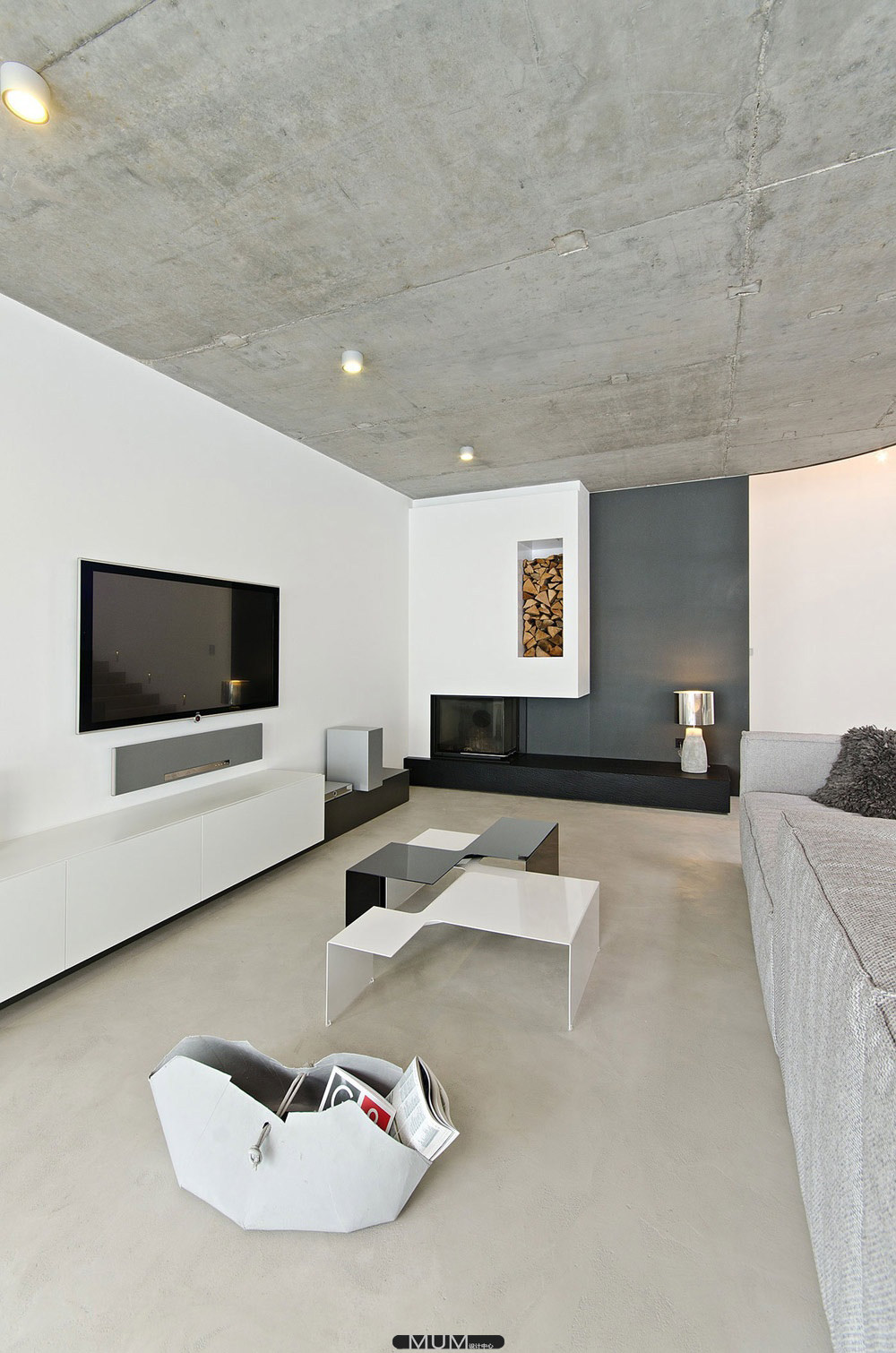 Concrete-Interior-Osice-Czech-Republic-Modern-Fireplace-Wood-Store1.jpg