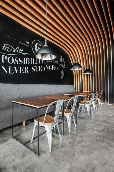 OOZN Design creates cavernous cafe in Jakarta using undulating timber slats_6-Degrees-Cafe-in-Indonesia-by-OOZN-Design_dezeen_3.jpg