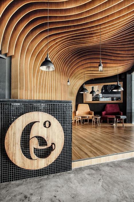 OOZN Design creates cavernous cafe in Jakarta using undulating timber slats_6-Degrees-Cafe-in-Indonesia-by-OOZN-Design_dezeen_6.jpg