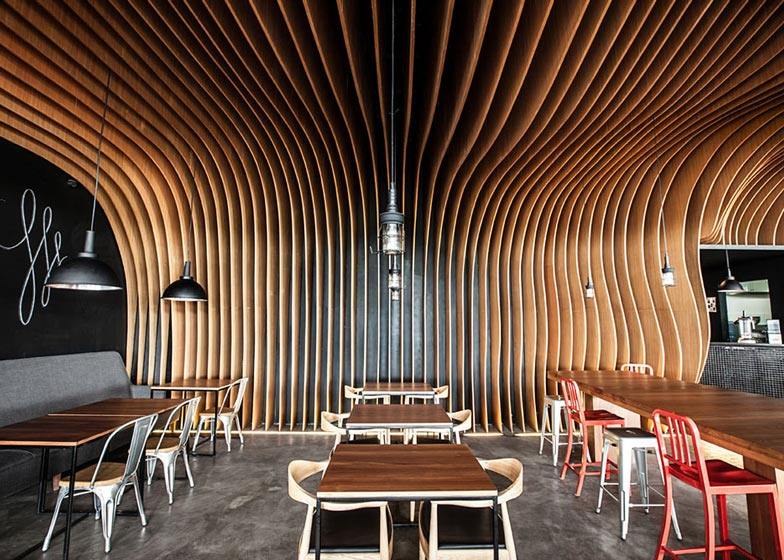 OOZN Design creates cavernous cafe in Jakarta using undulating timber slats_6-Degrees-Cafe-in-Indonesia-by-OOZN-Design_dezeen_ss_5.jpg