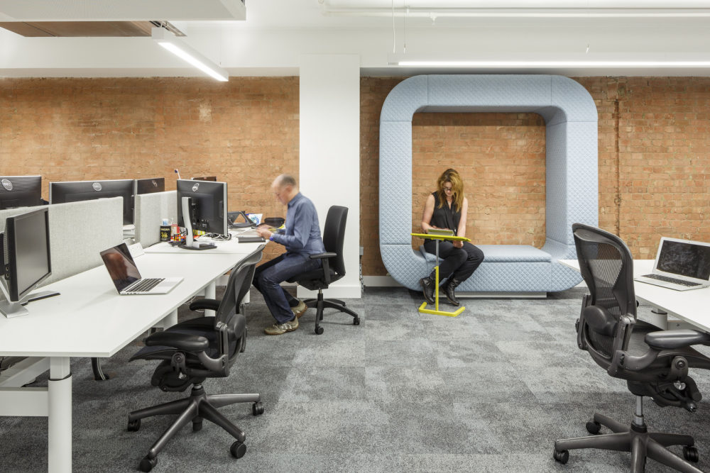 Mendeley Offices – London_33-The-Snug-at-the-end-of-workzone-2-has-upholstered-seating-and-a-quilted-surround.jpg