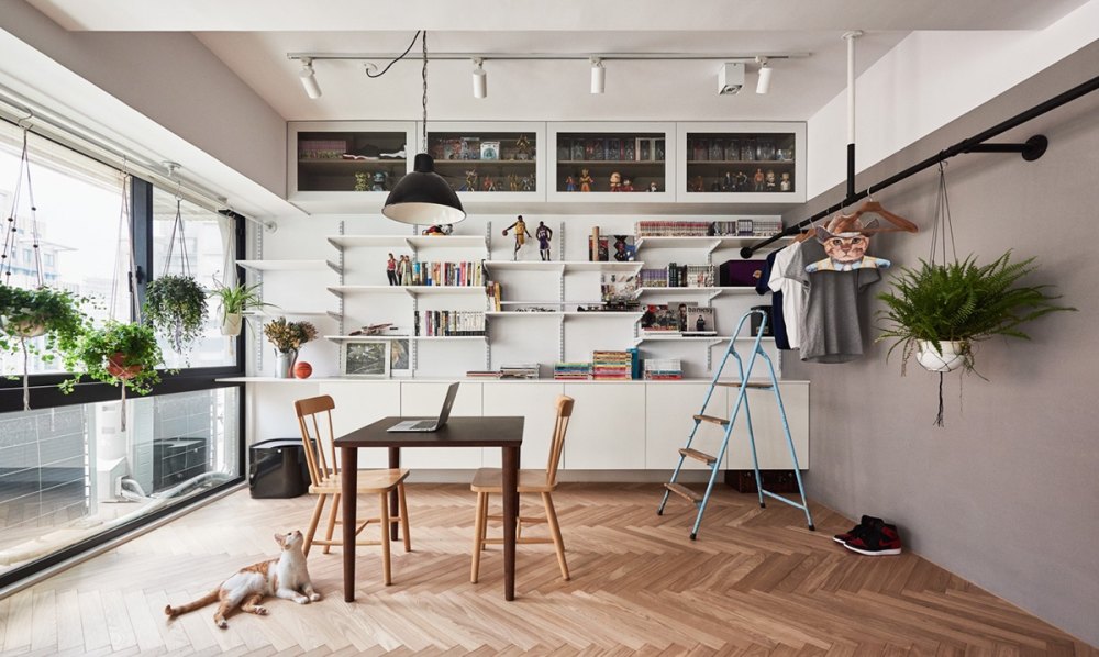 Cat Owner’s Cramped Apartment Gets Room to Breathe_mini-loft-custom-white-walls-accent-pieces.jpg