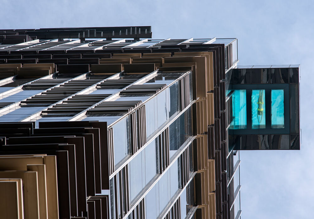 aedas-designed-the-hotel-indigo-in-hong-kong-with-a-swimming-pool-that-hangs-out-over-the-edge-of-the-building-01.jpg