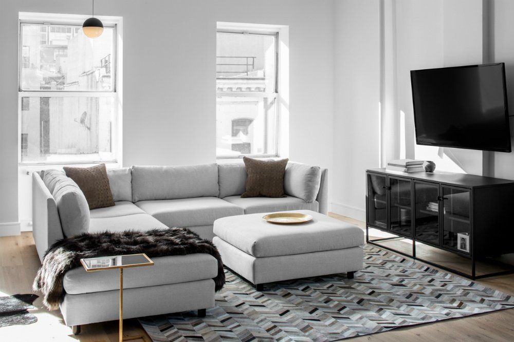 国外作品 | Decor Aid-ed: TriBeCa Loft Filled With Neutrals_A-glass-cabinet-looks-smart-and-dandy-as-a-TV-console.jpg