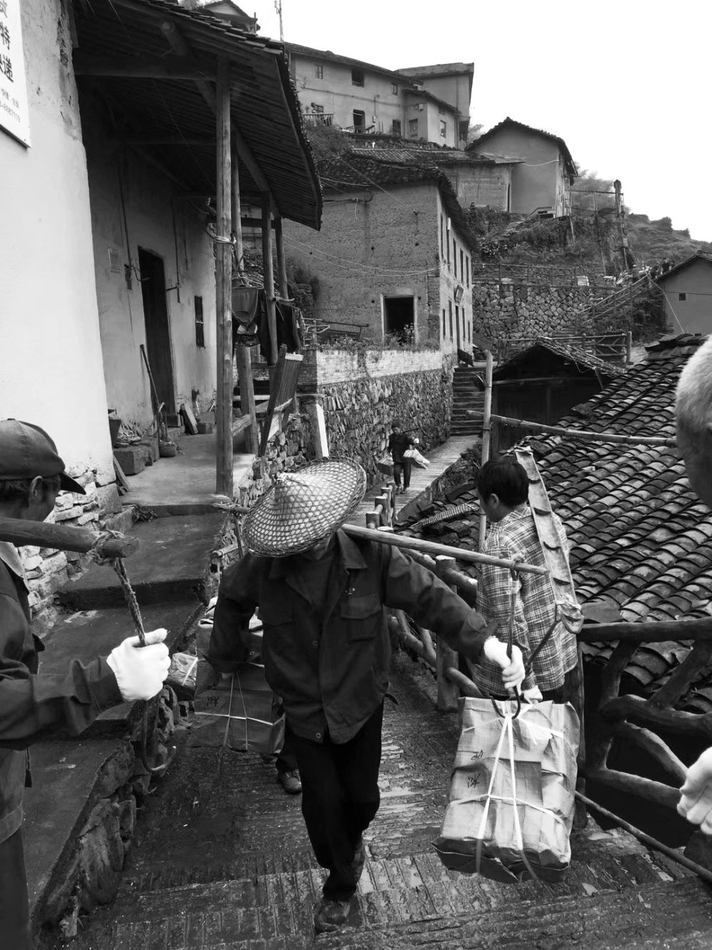 05_local_villagers_carry_books.jpg