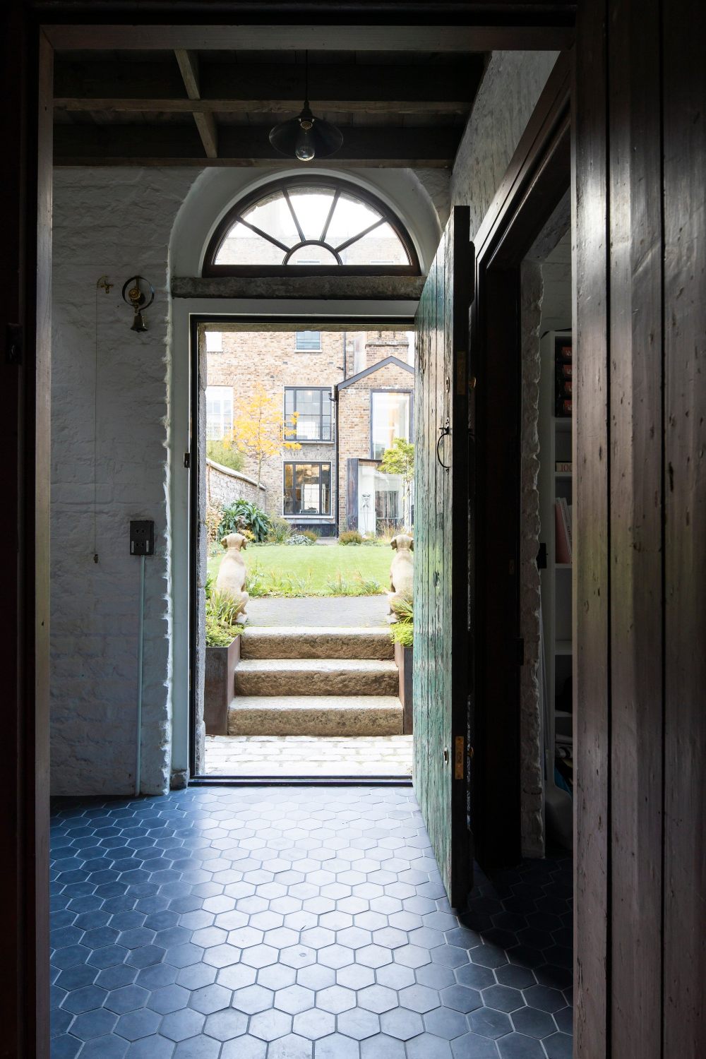 D2_Townhouse_view_from_coach_house_and_concrete_hexagon_tiles_Design_by_Jake_Moulson_Image_©Tim_Crocker_1925.jpg